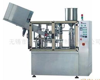 Automatic tube filling and sealing machine