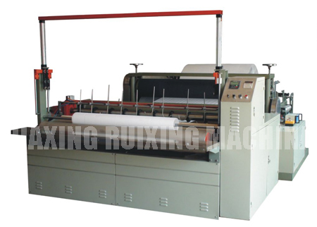 Nonwoven fabric rewinding machines