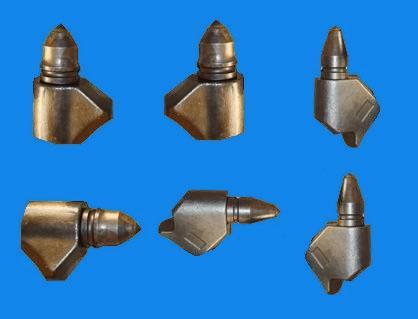 Round shank bits for foundation drilling