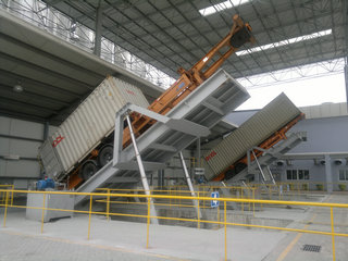 Container discharger system