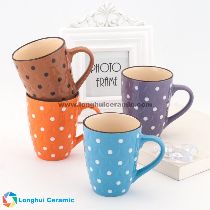 Embossed ceramic mug with dots painted