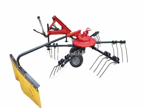 Tractor mounted hay raker