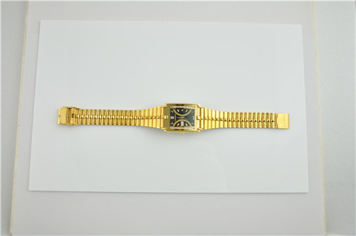 Shiny gold square brass watch with domed glass
